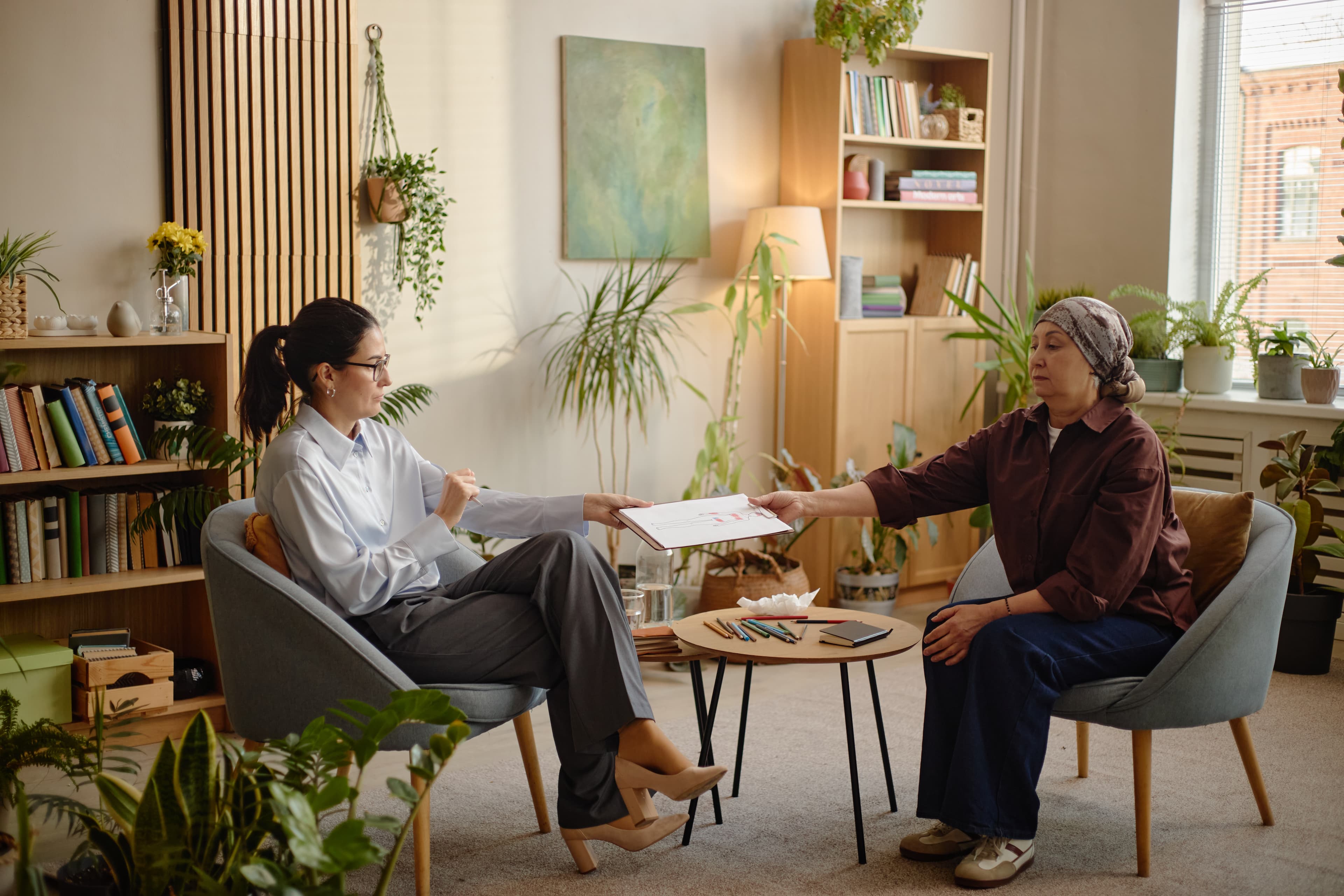 Therapist and client in a warm, welcoming office setting